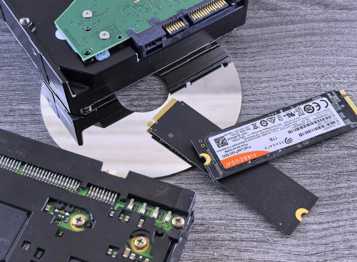 Contrasting data storage technologies: NVMe SSD, HDD, and CD.