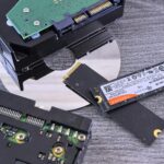 Contrasting data storage technologies: NVMe SSD, HDD, and CD.